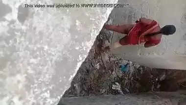 Sexy telugu aunty standing and peeing in open