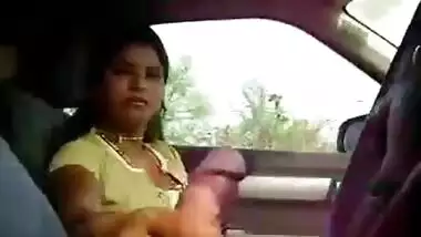 Kinky slut masturbates cock in a car