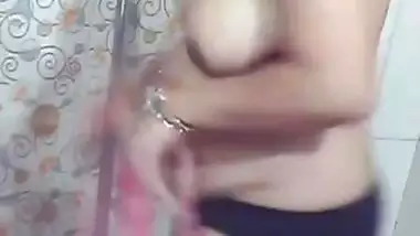 Beautiful MILF stripping in bathroom before nude bath