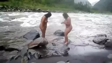 Two fat Desi women show their XXX assets while relaxing naked in river